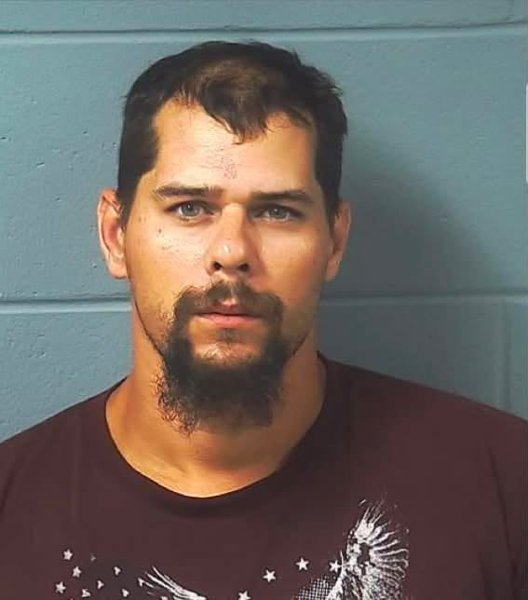 Booking photo — David J. Goepfert