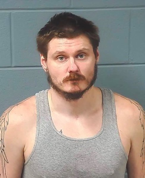 Booking photo — Justin J. Laduke