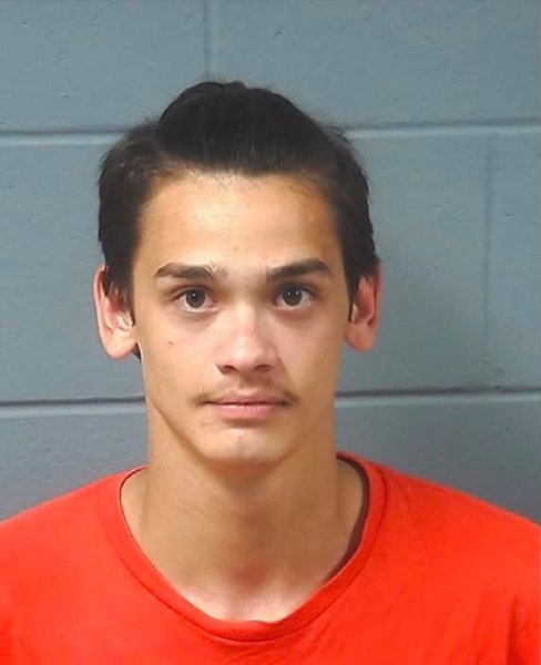 Booking photo — Carlos R. Castro