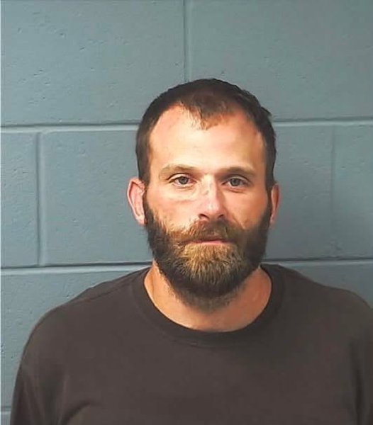 Booking photo — Jeremy M. Rader