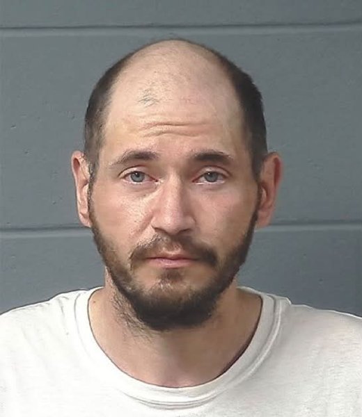 Booking photo — Joshua R. Woller