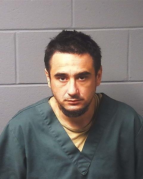 Booking photo — Timothy J. Hughes